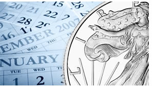 Silver coin on calendar